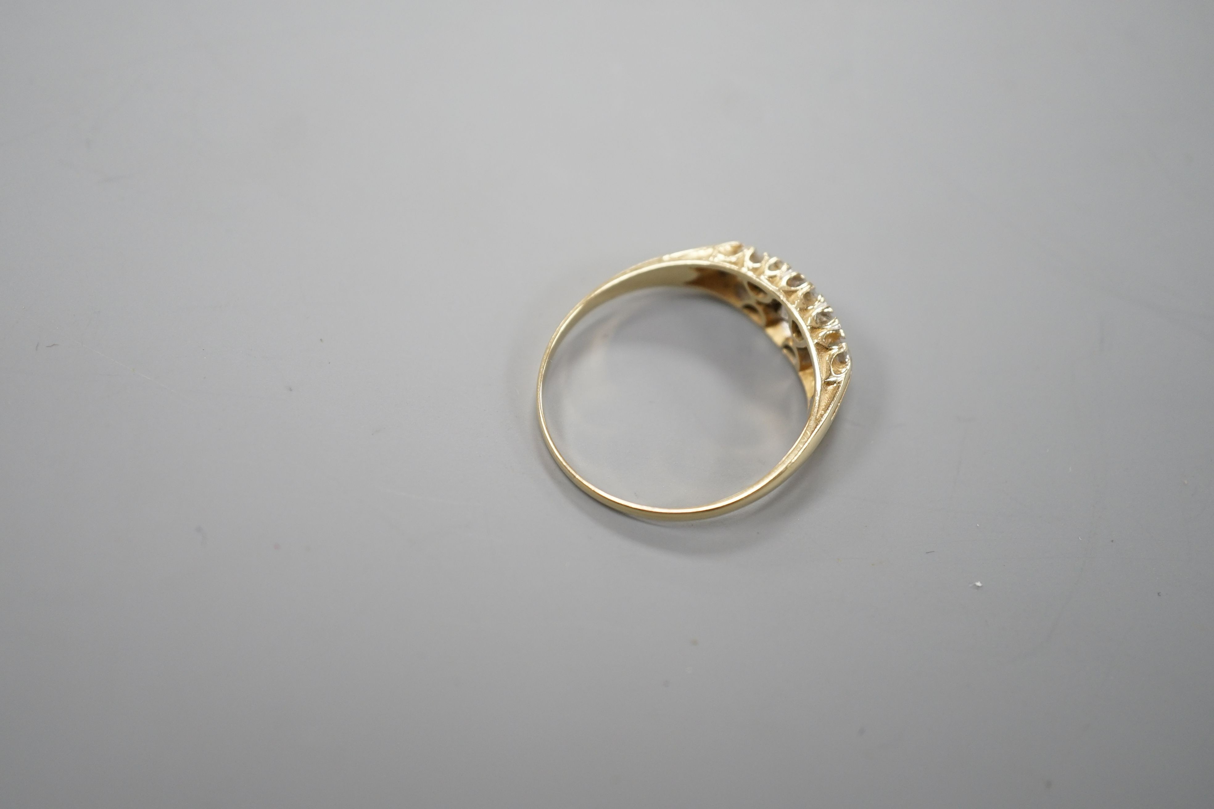 An 14ct gold and diamond dress ring, size T, gross 3.2 grams